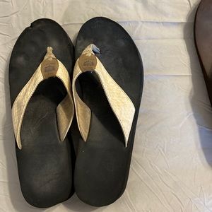 Flip flops. Size 10, black with beige straps